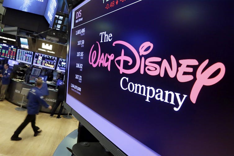 A Walt Disney Company logo displayed on a large screen inside a building