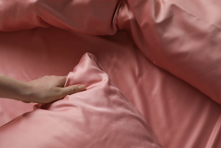 Bed with silk sheets and pillowcases