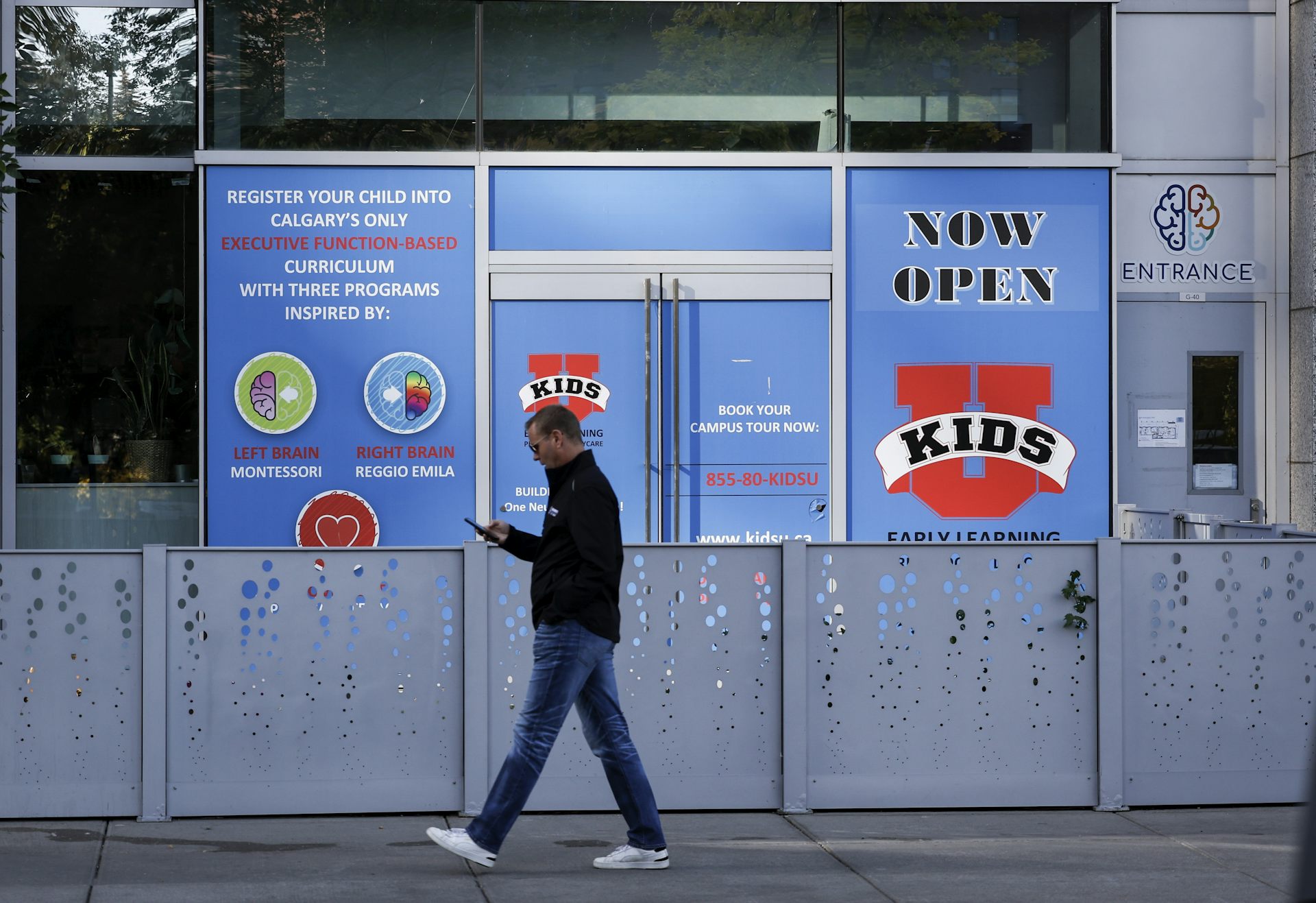 A man walks past a day-care centre.