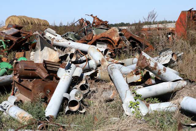 A heap of twisted metal tubes and rusted machinery