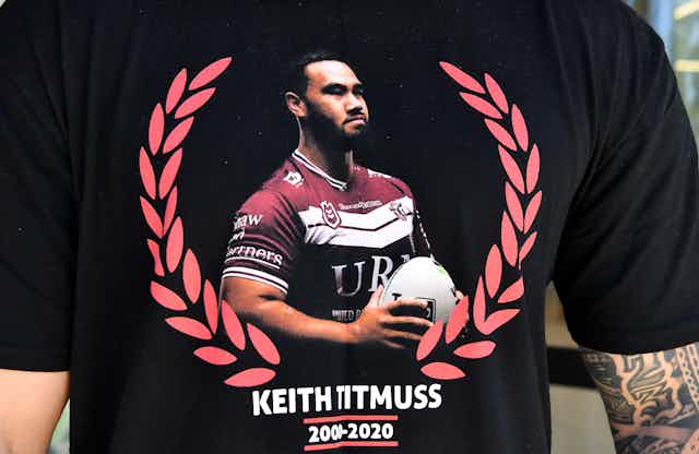 Family and friends wear t-shirts in memory of Keith Titmuss. 