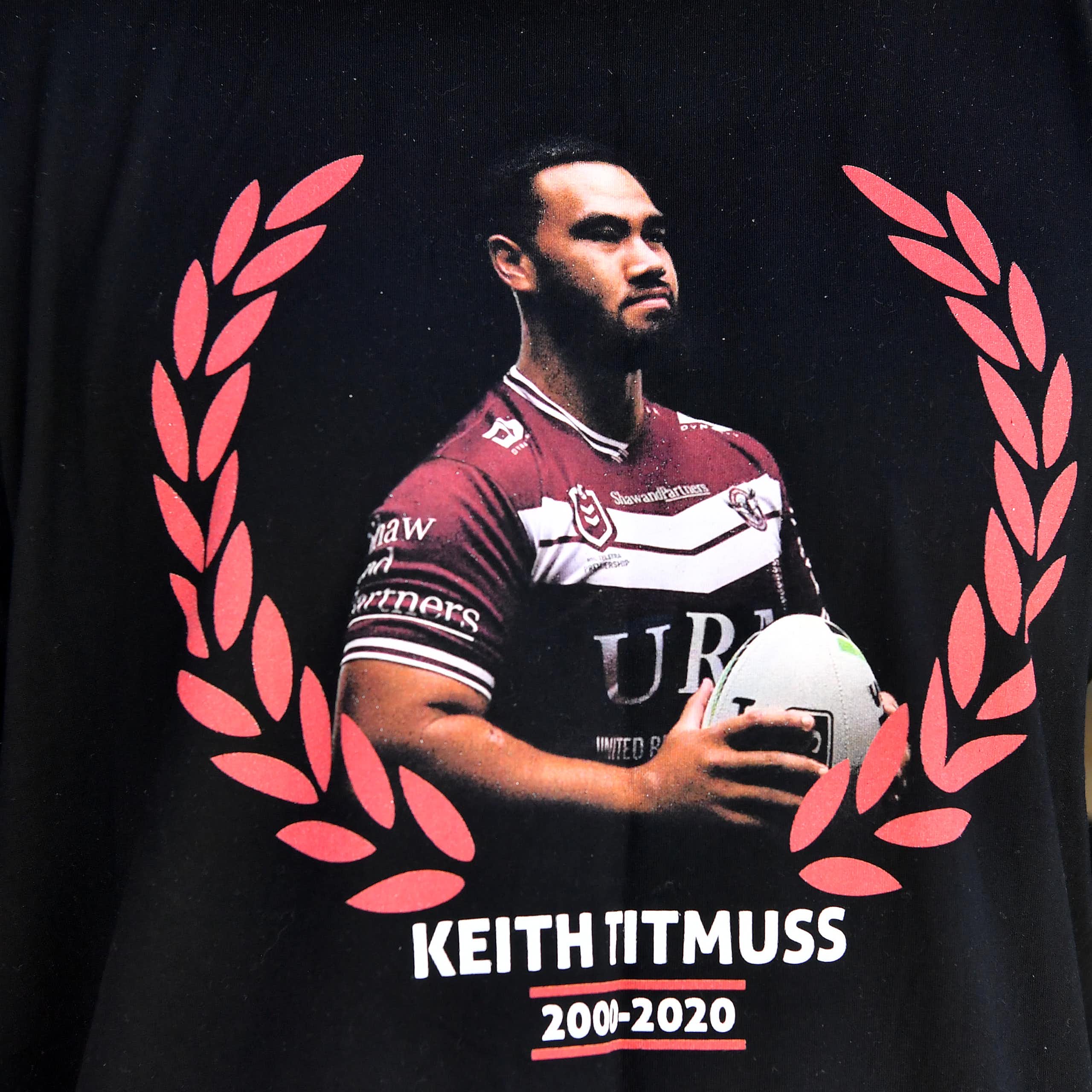 Family and friends wear t-shirts in memory of Keith Titmuss. 