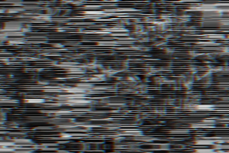 Black and white horizontal lines partially obscuring vague shapes