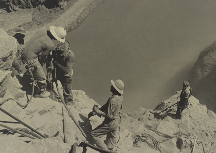 workers building a dam