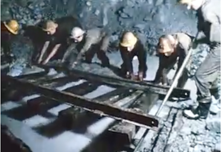 men working on hydroelectric tunnel