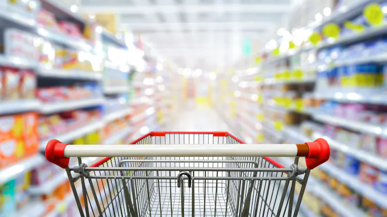 An empty shopping cart in a supermarket