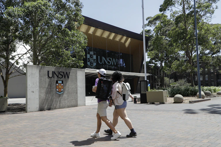 Students walk around a campus in Sydney.