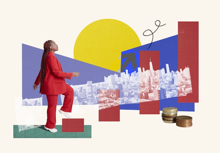 A woman in a red suit walks on steps that look like bars from a bar graph -- and a panoramic view of a city is in the background.