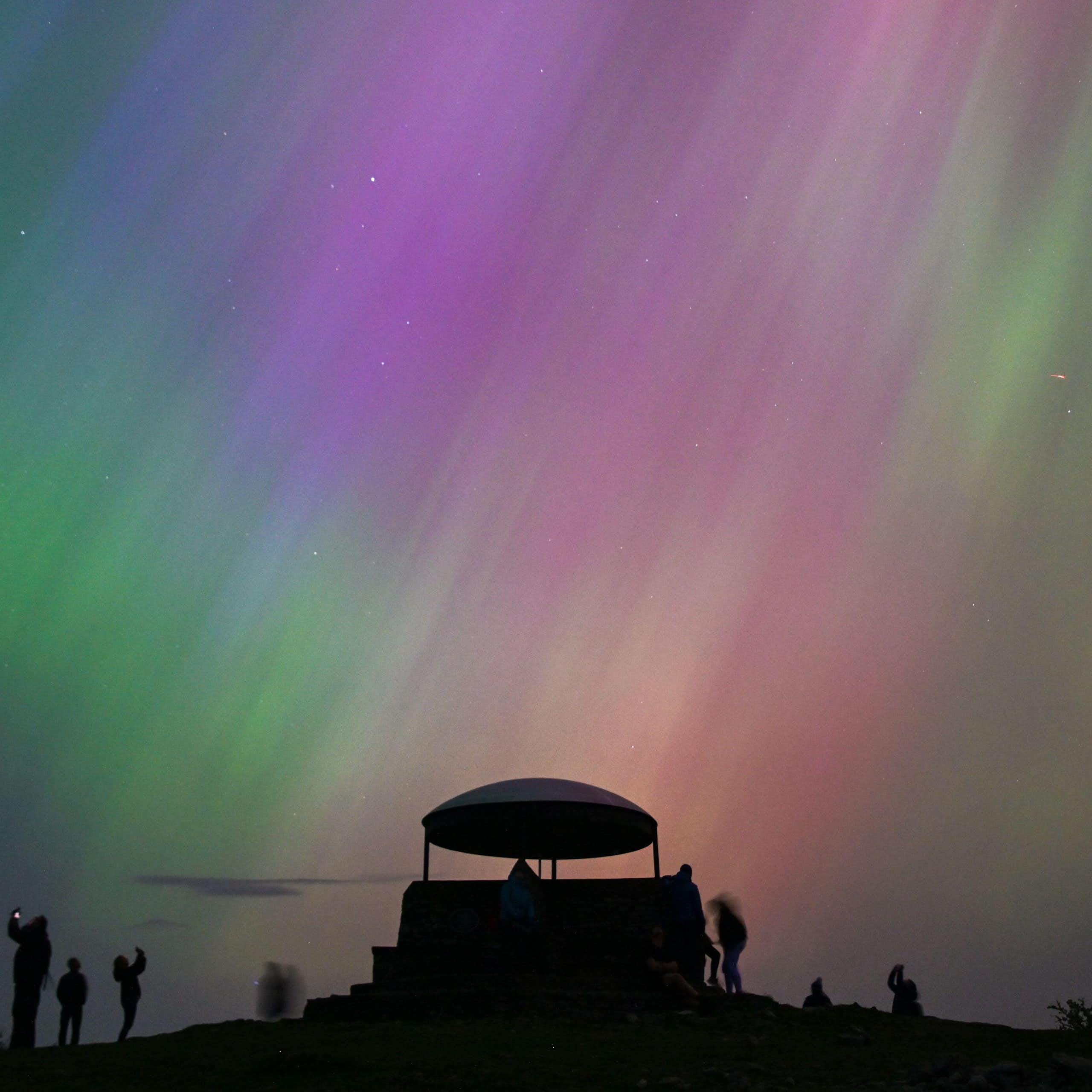 People looking at the Northern Lights