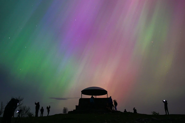People looking at the Northern Lights