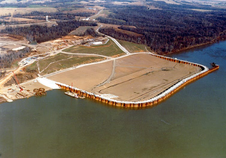 Aerial view of a construction site extending into a river