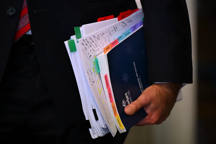 A stack of annotated budget papers.