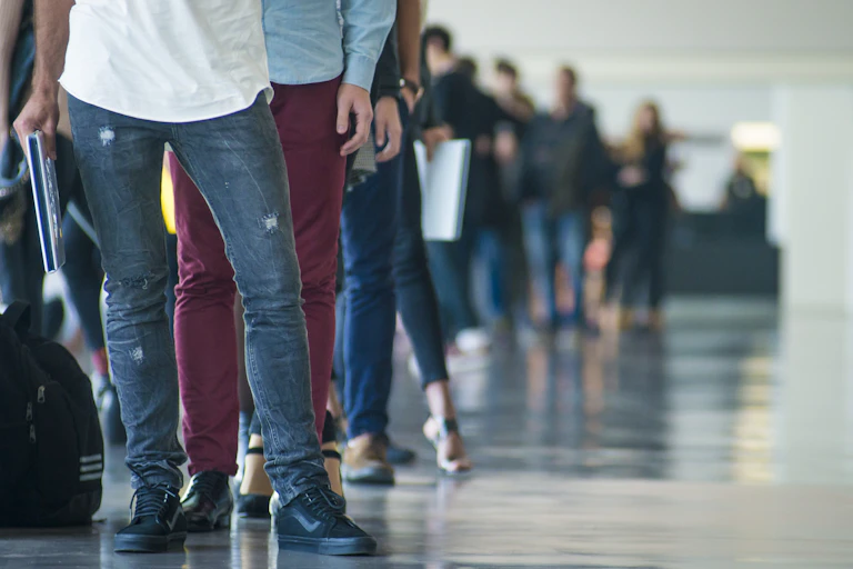 Unidentified people standing in a queue
