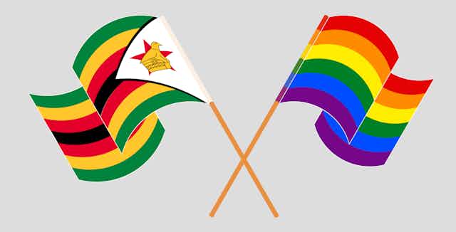 An illustration of two flags, crossed at their bases, one a Zimbabwean flag and the other a rainbow flag.