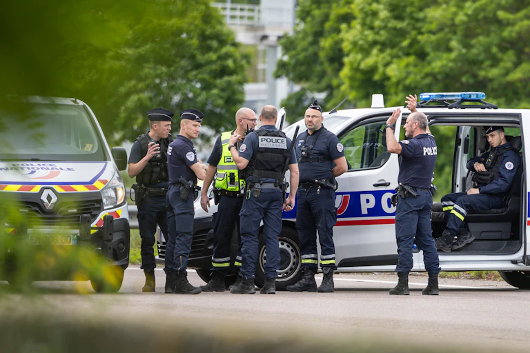 Police gathered around a van.