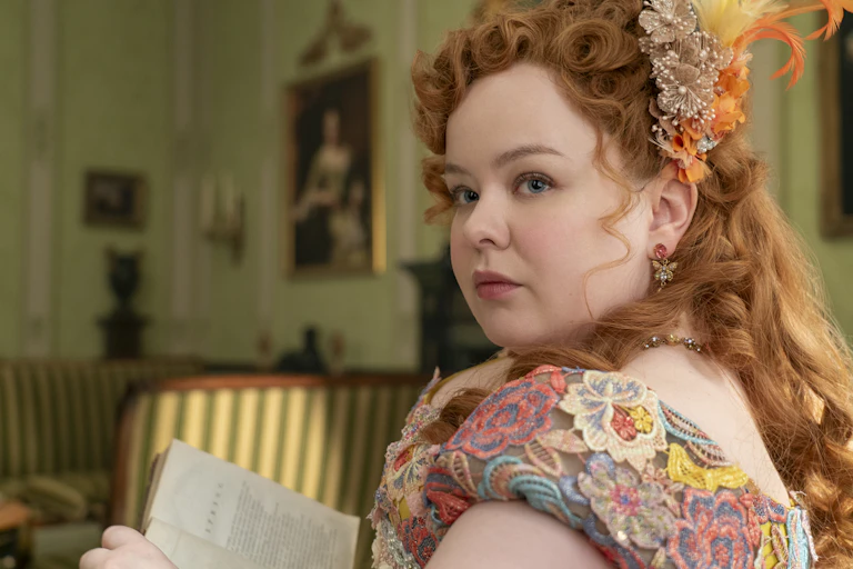 Penelope Featherington reading a book.