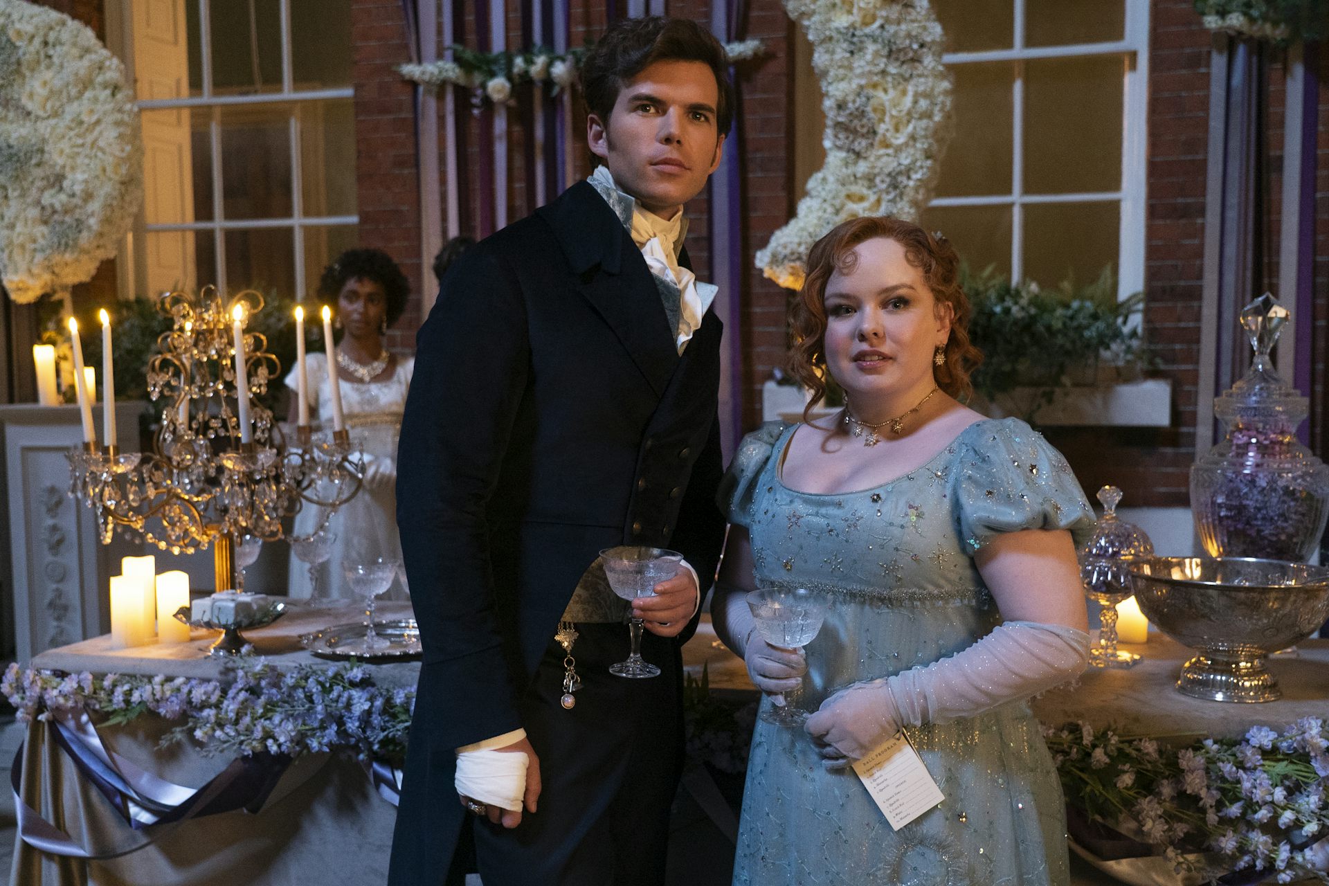 Penelope Featherington and Colin Bridgerton at a ball.