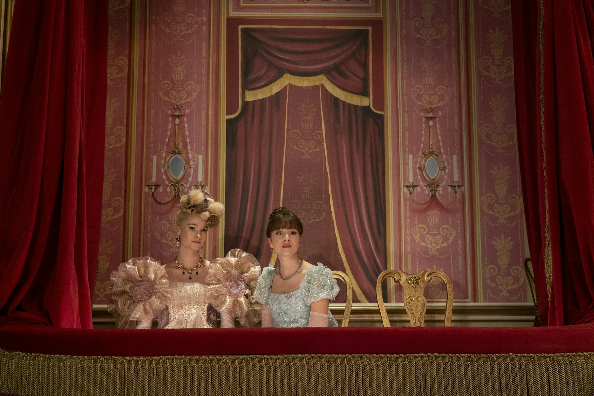Cressida Cowper and Eloise Bridgerton in a box at the theatre.