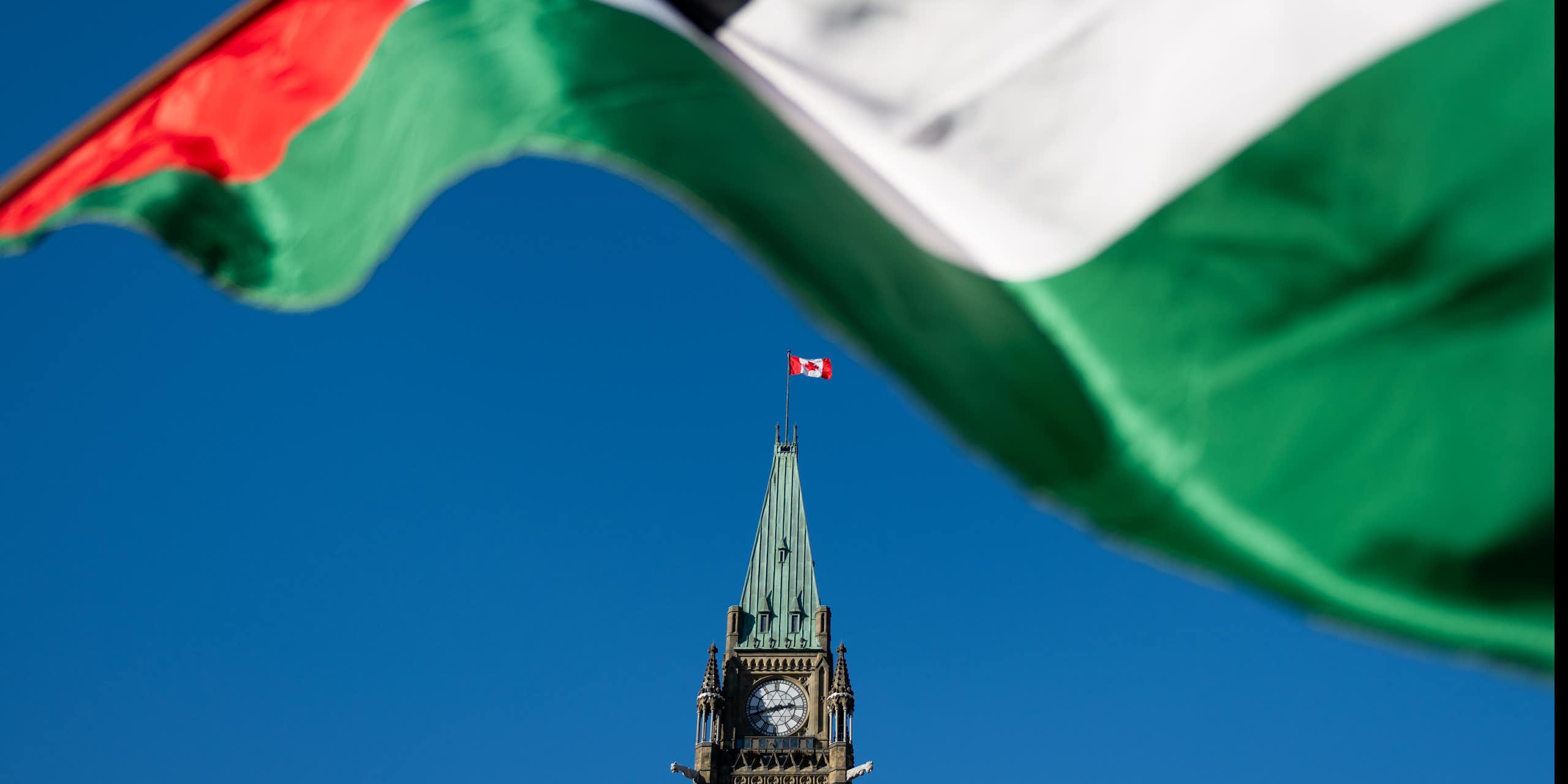 A Palestinian flag flies in front the peace tower at the Canadian parliament