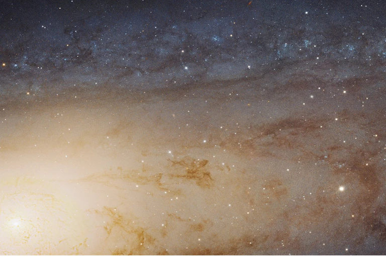 a photo of the sky with a bright spot in the lower left corner and navy blue background with white spots