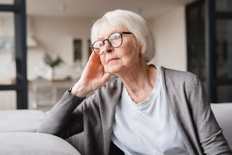 Older woman gazes into the distance