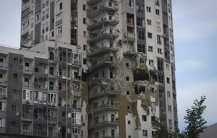 A partially destroyed apartment building.
