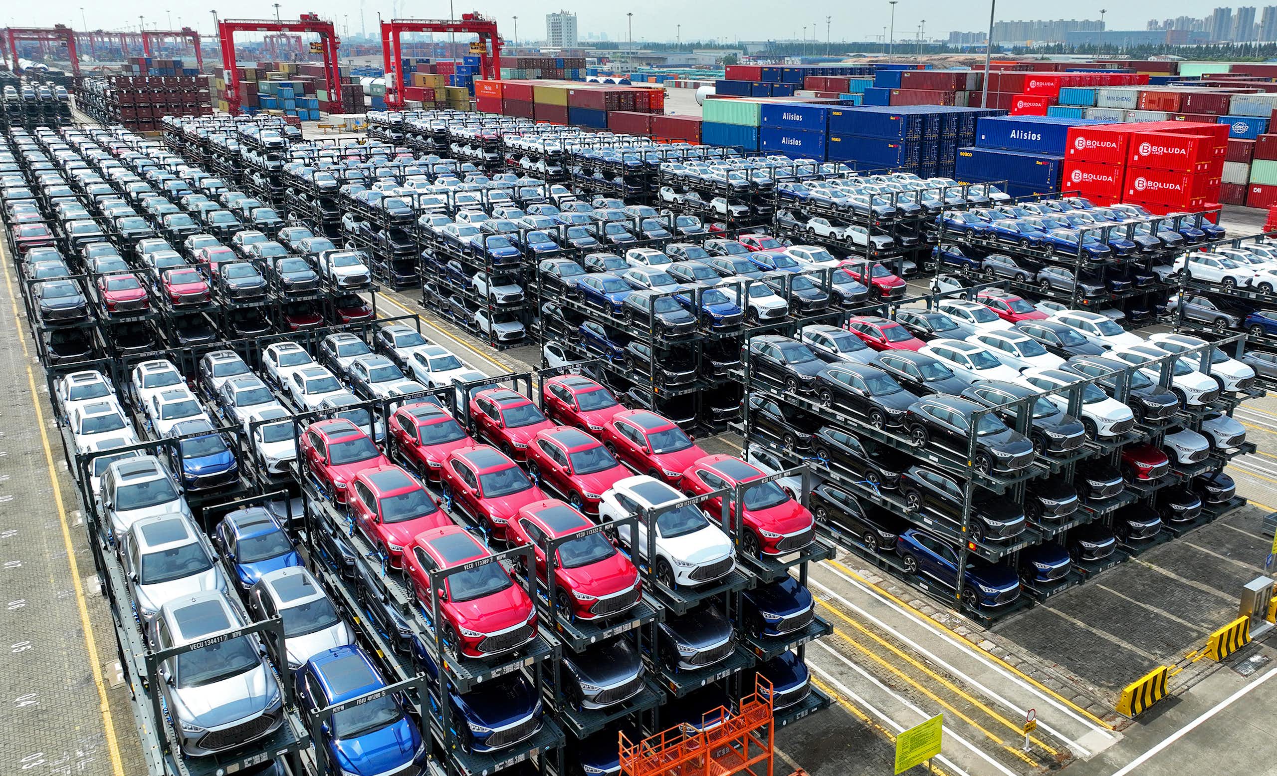 BYD vehicles are stacked three high for loading on a ship.