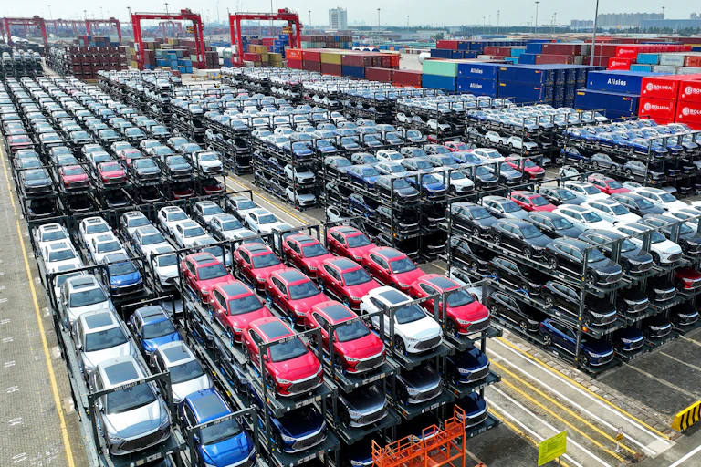 BYD vehicles are stacked three high for loading on a ship.