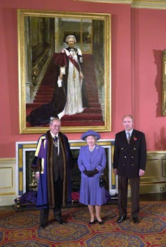 The late Queen with her portrait and the artist.
