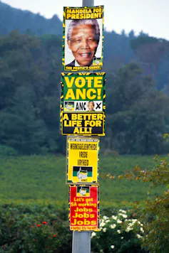 A post covered in ANC posters in 1994.