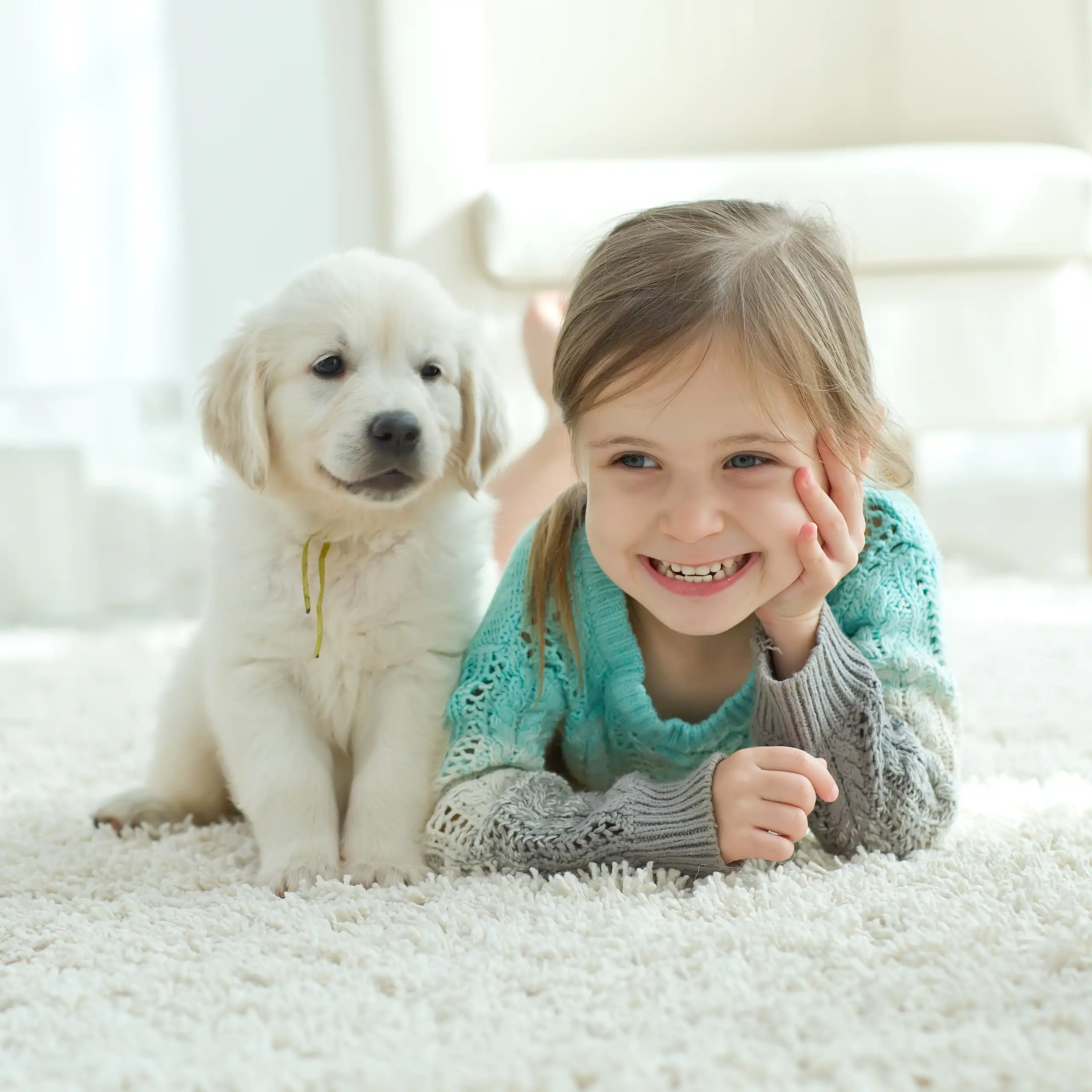 A puppy and a little girl.