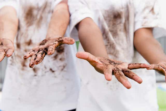 Children display dirty hands