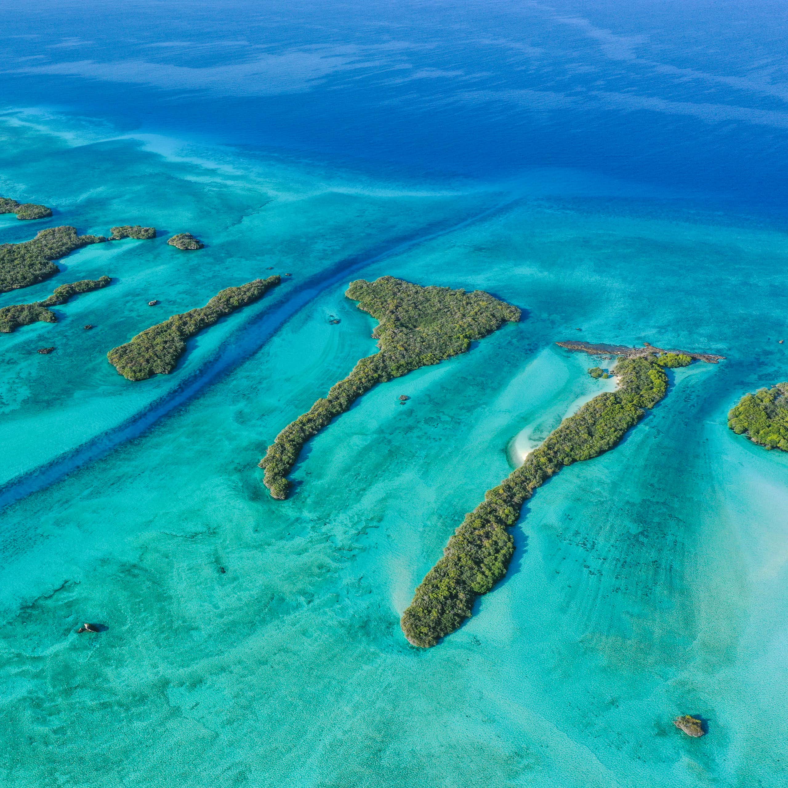 Aerial view of small islands in the ocean.