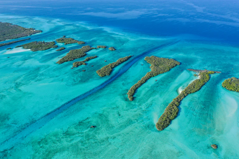 Aerial view of small islands in the ocean.