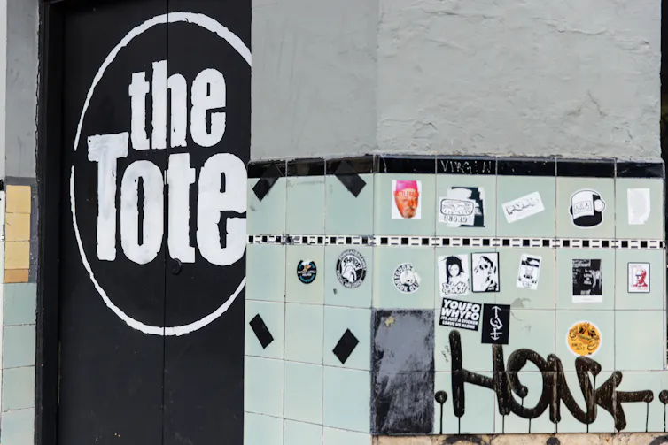 A pub door reads The Tote.