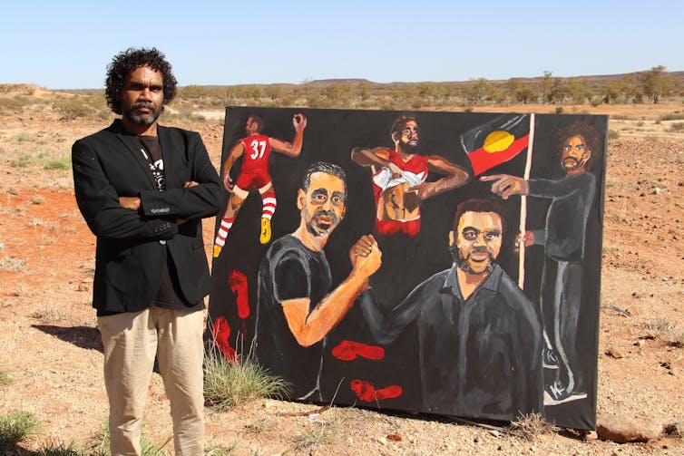A man and a painting.