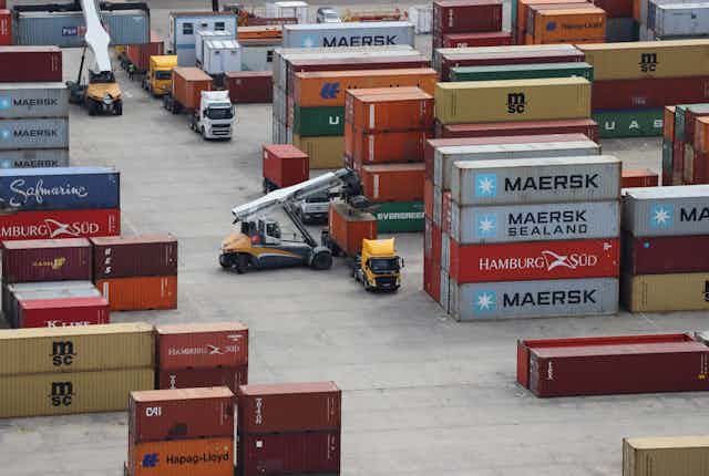 Aerial photo of trucks waiting have their containers offloaded at the Durban port