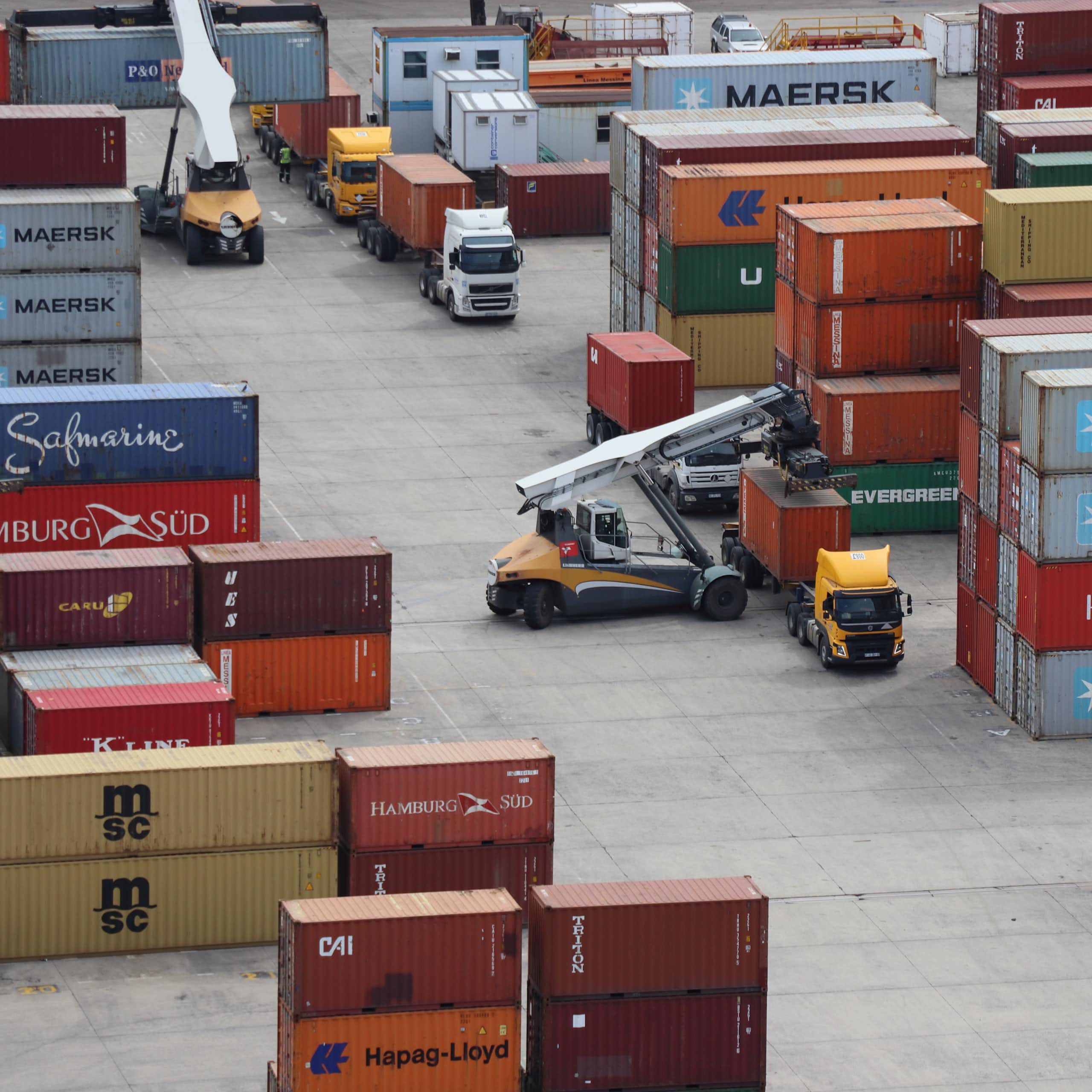 Aerial photo of trucks waiting have their containers offloaded at the Durban port