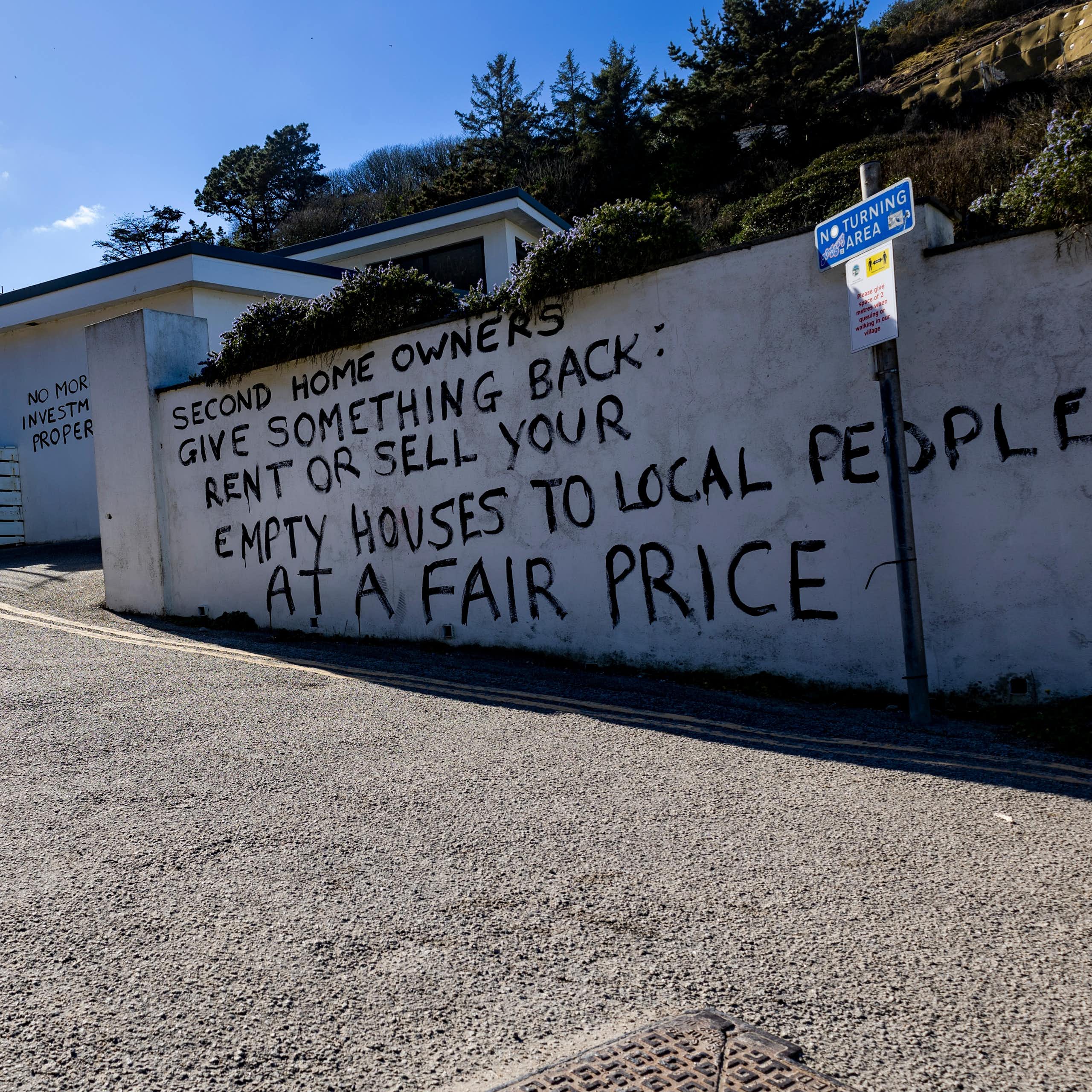 A protest message painted on a wall. 