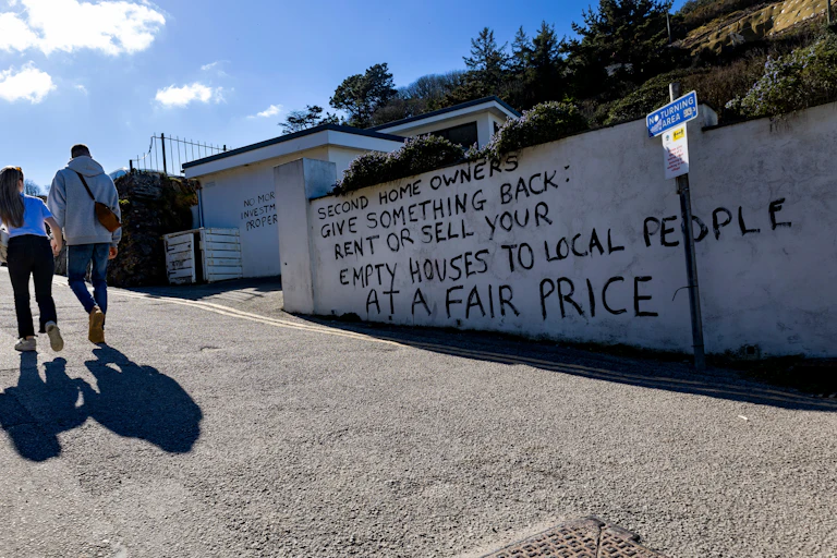 A protest message painted on a wall.