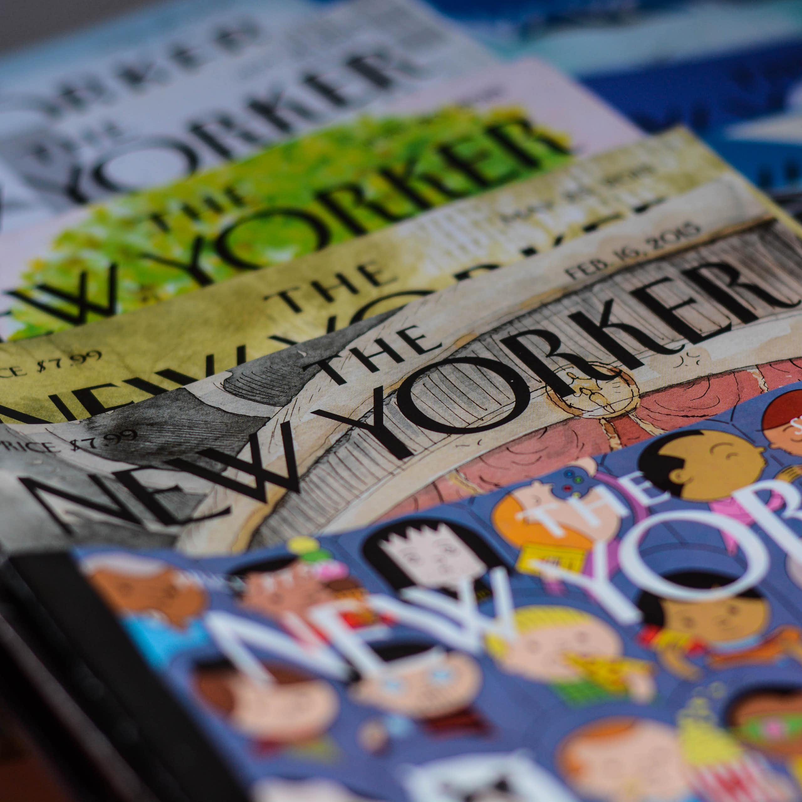 A stack of old print editions of the New Yorker magazine