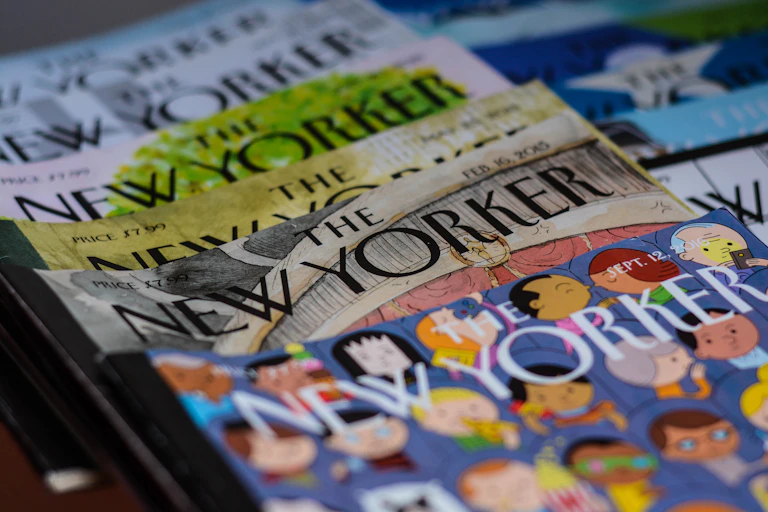 A stack of old print editions of the New Yorker magazine