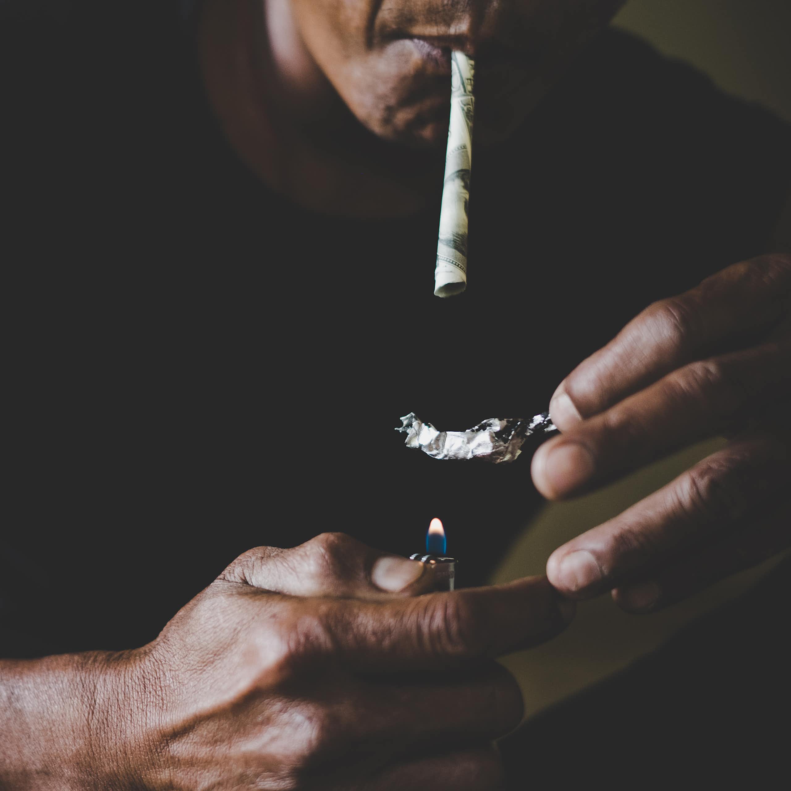 A man smoking heroin