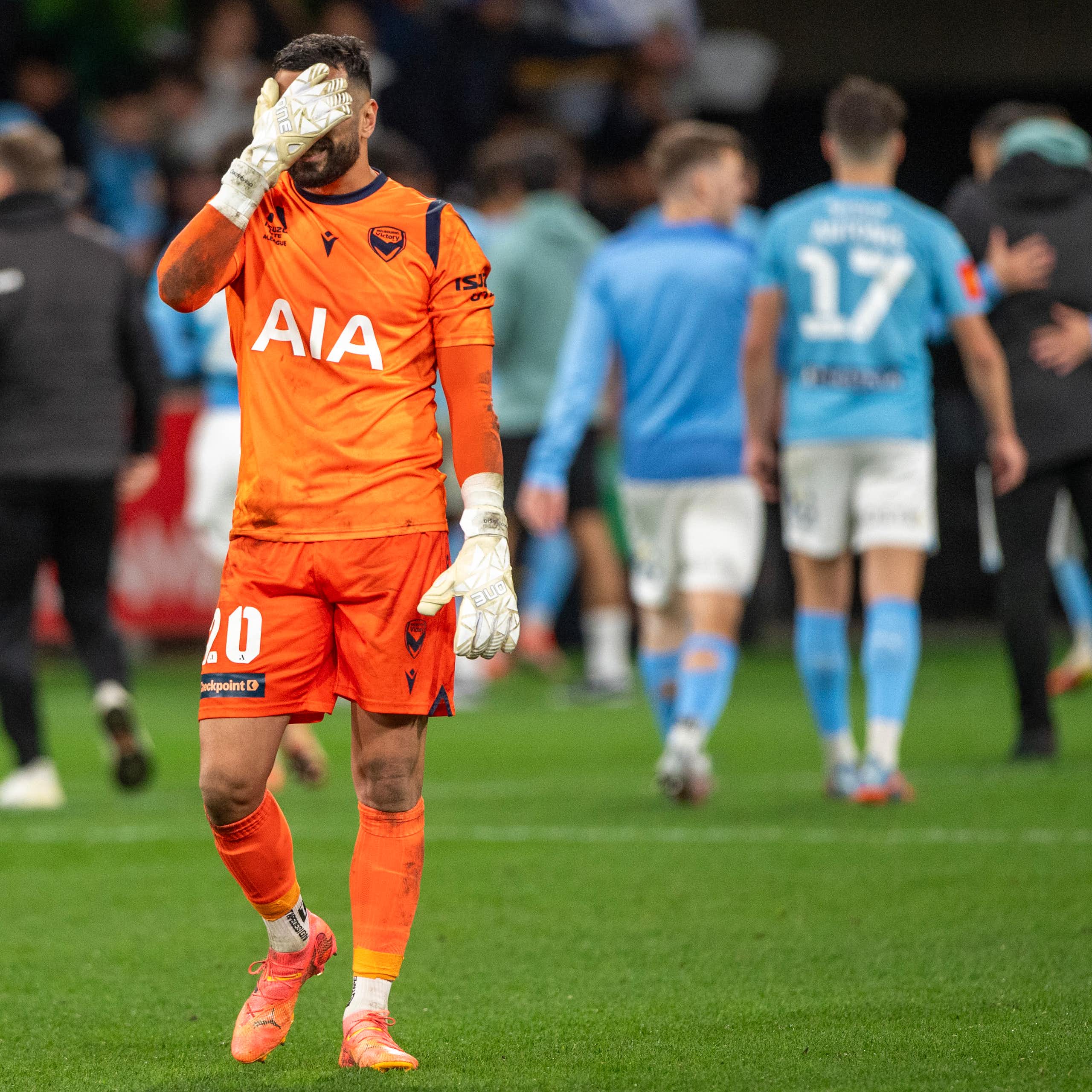 Paul Izzo, Melbourne Victory goalkeeper, walks off dejectedly after a loss