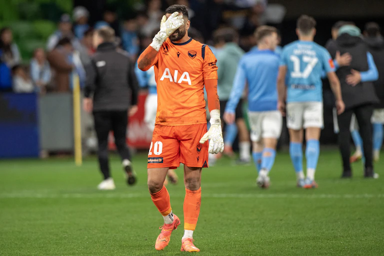 Paul Izzo, Melbourne Victory goalkeeper, walks off dejectedly after a loss