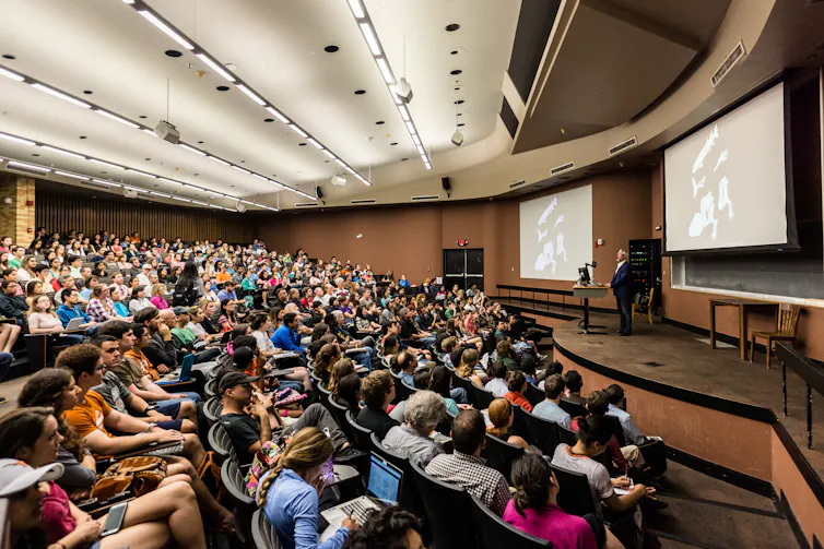 A university lecture theatre full of students