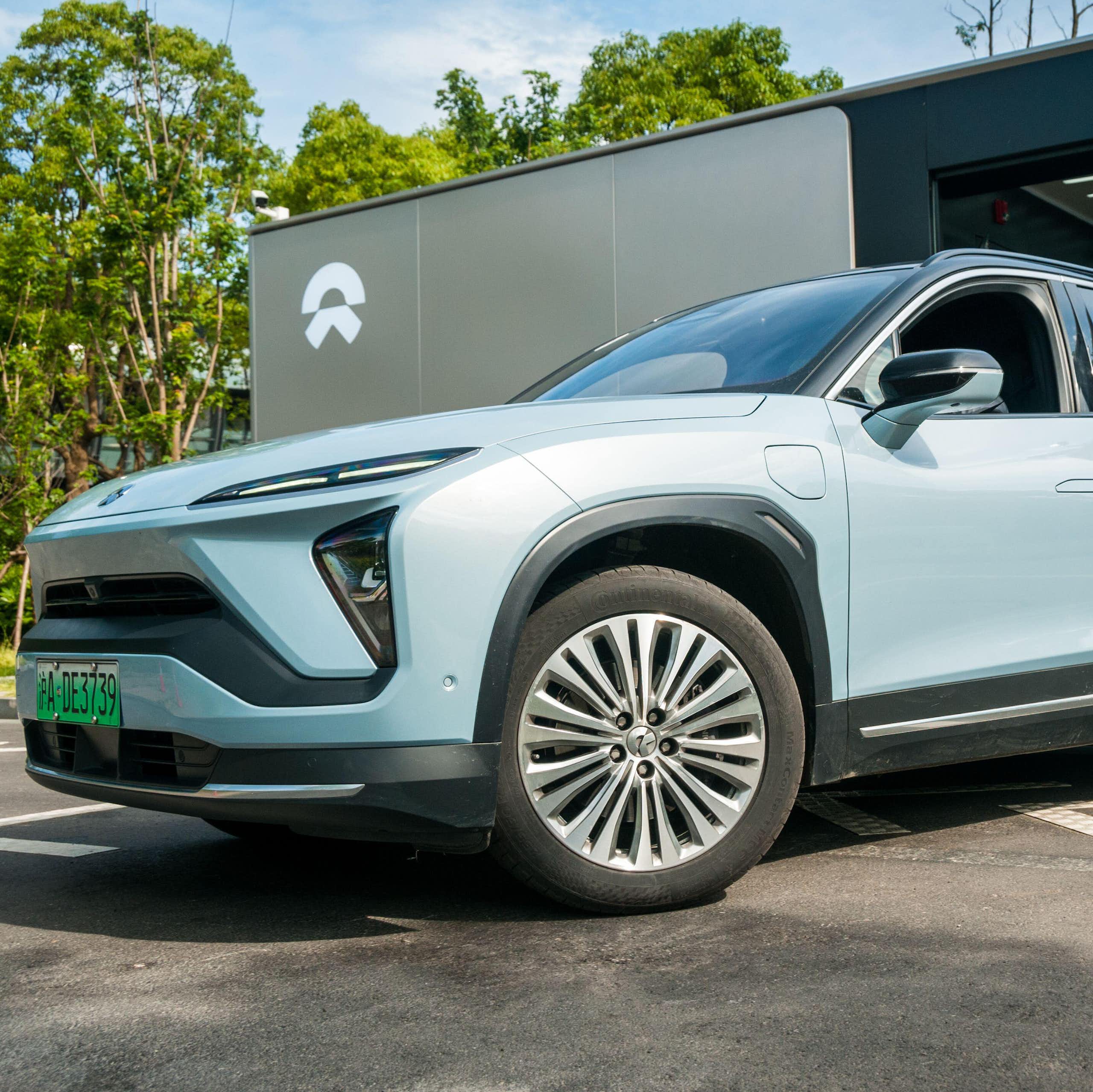 Nio car emerging from a battery swapping station in China