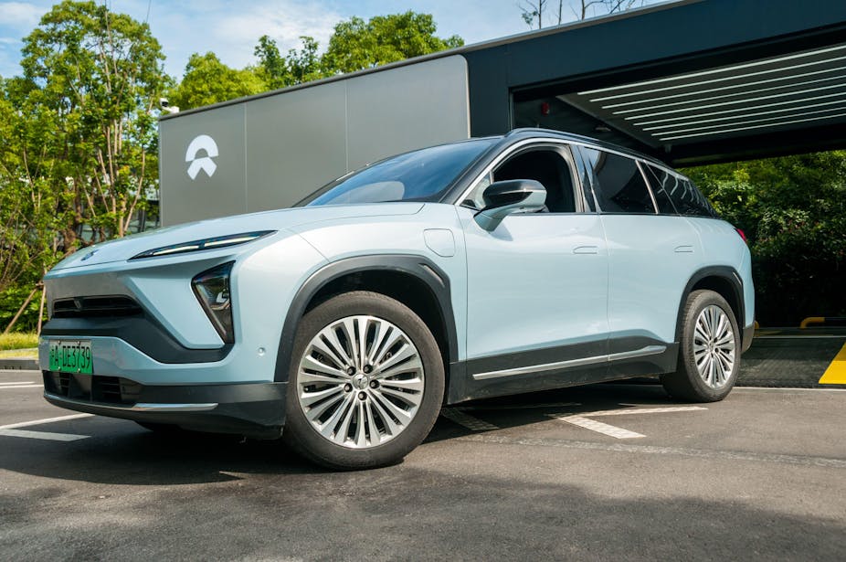 Nio car emerging from a battery swapping station in China