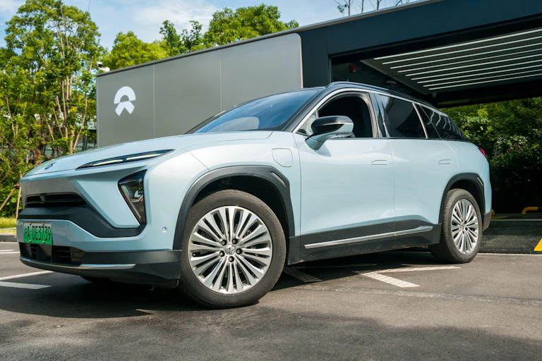 Nio car emerging from a battery swapping station in China