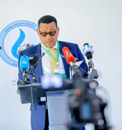 A man speaks into a microphone